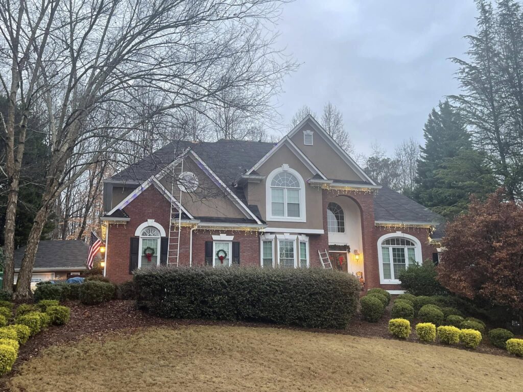 Christmas lights installed along the rooflines of a Northwest Georgia home by Roof Works