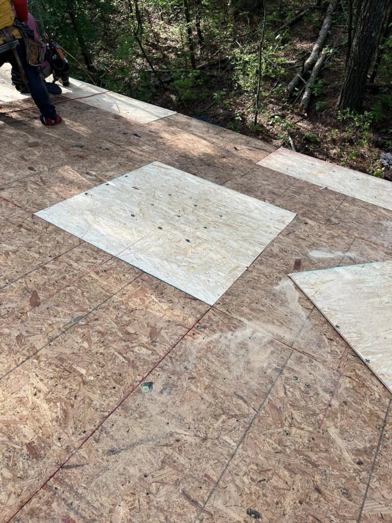 Asphalt roof replacement in progress by Roof Works