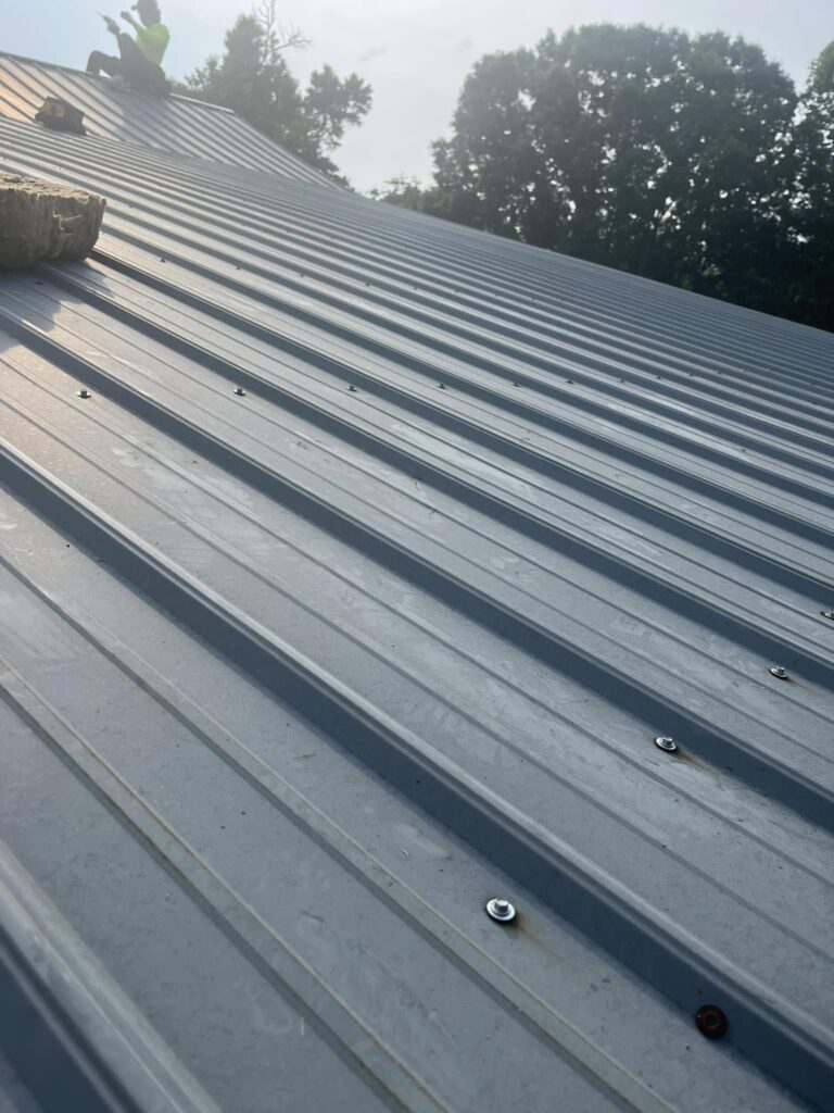 Standing seam metal roof panels installed by Roof Works