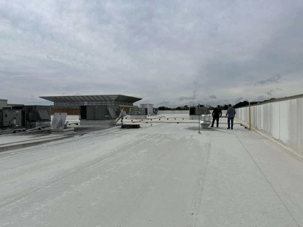 The Roof Works team on a completed commercial TPO roof