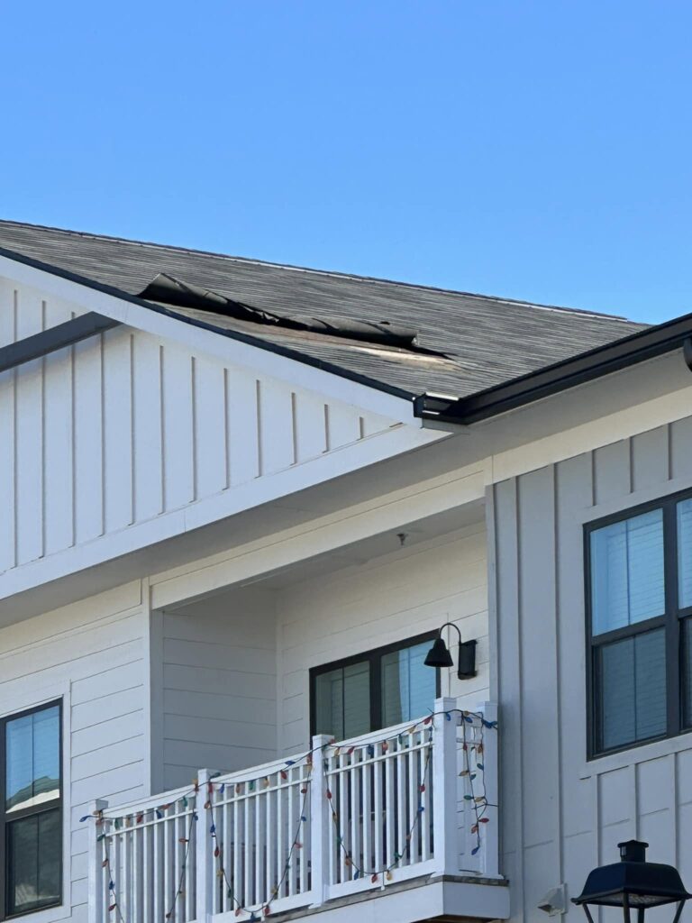 Wind damage to the roof of a NW Georgia home