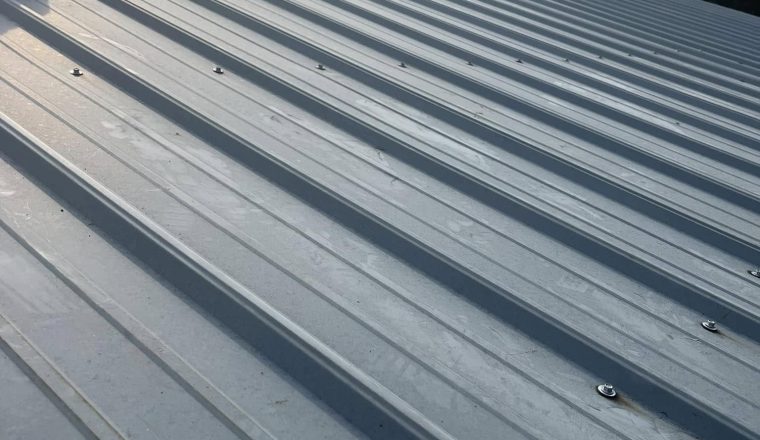 Standing seam metal roof panels installed by Roof Works