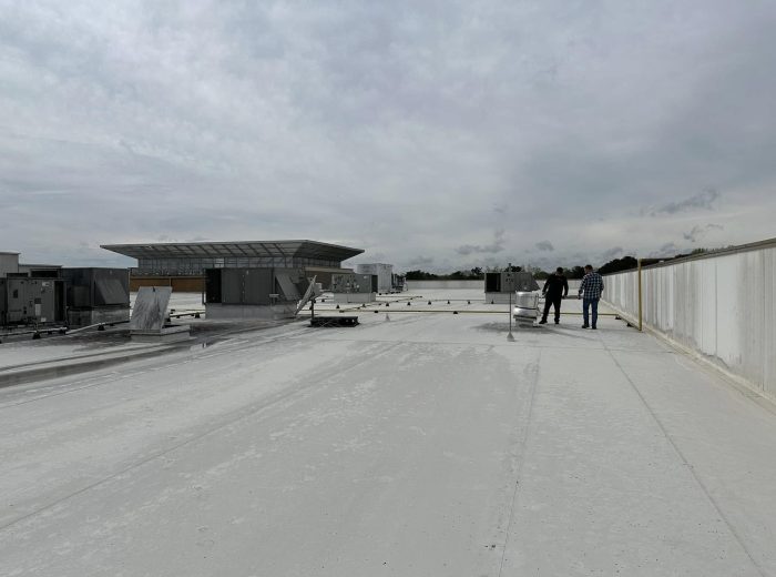 The Roof Works team on a completed commercial TPO roof