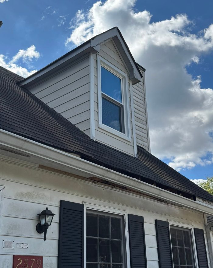 A finished dormer window and siding by Roof Works