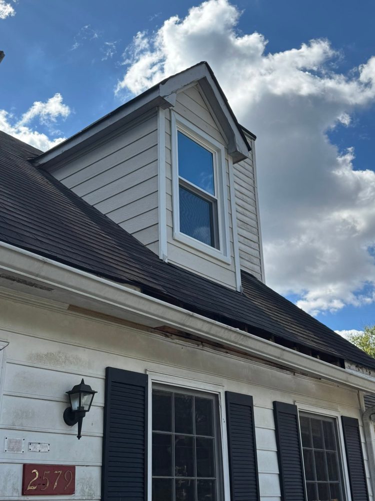 A finished dormer with new windows and siding on a NW Georgia home by Roof Works